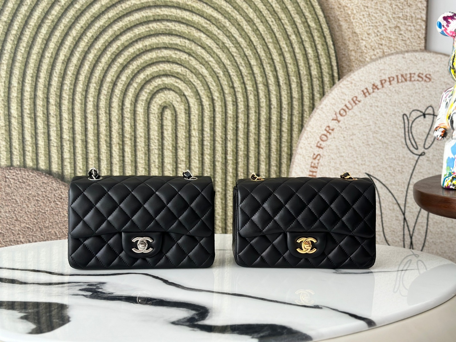 Black Chanel flap bag with top handle in quilted leather